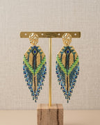 Boucles d'oreilles Fantasia pendantes perles de verre vert, bleu et doré effet paon, puce acier inoxydable doré - Terre à Perles
